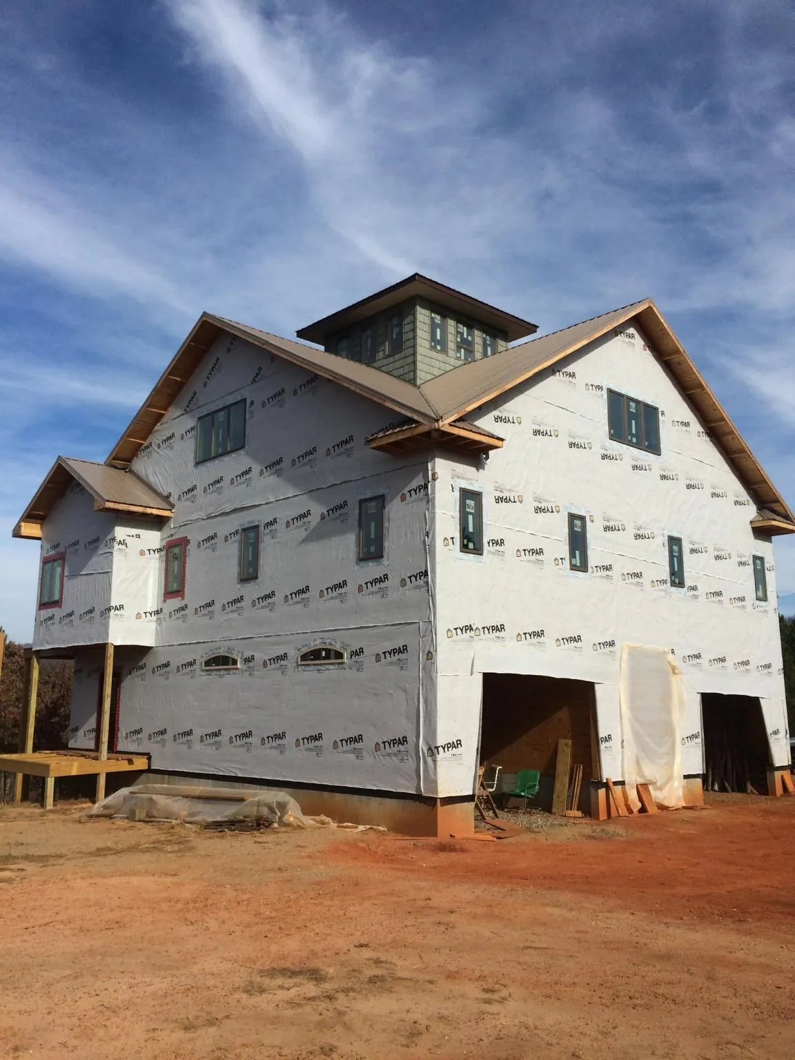New two story house under construction with a cupola and gabled roofs in Paint Bank